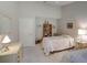 Comfortable bedroom with two beds, bright decor, and ample closet space at 3910 Saywood Ct, Palm Harbor, FL 34685