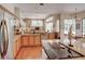 Well-lit kitchen with granite countertops, stainless steel appliances and hardwood floors at 3910 Saywood Ct, Palm Harbor, FL 34685