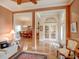 Open-concept living space with hardwood floors, archways, and elegant finishes at 3910 Saywood Ct, Palm Harbor, FL 34685