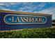 Community entrance sign displaying the 'Lansbrook' name with a classic blue and gold design at 3910 Saywood Ct, Palm Harbor, FL 34685