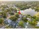 Aerial view of the property with the lake in the background at 3925 Dunaire Dr, Valrico, FL 33596