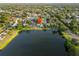 Aerial view of the property with the lake in the background at 3925 Dunaire Dr, Valrico, FL 33596