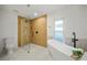 Contemporary bathroom with a glass shower, soaking tub, and modern fixtures at 3925 Dunaire Dr, Valrico, FL 33596