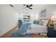 Bedroom with modern decor and sliding glass doors, offering a tranquil view of the outdoors at 3925 Dunaire Dr, Valrico, FL 33596