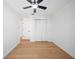 Clean bedroom has wood floors, white walls, a ceiling fan, and closet at 3925 Dunaire Dr, Valrico, FL 33596
