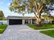 Charming single story home with a large shade tree, brick driveway and nicely landscaped front yard at 3925 Dunaire Dr, Valrico, FL 33596