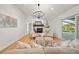 Open living room with fireplace, comfortable seating, and a view of the pool at 3925 Dunaire Dr, Valrico, FL 33596