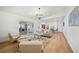 Open living room with comfortable seating, fireplace, and access to the outdoor patio at 3925 Dunaire Dr, Valrico, FL 33596