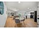 Open-concept living space with a white kitchen, cozy living room, and dining nook at 3925 Dunaire Dr, Valrico, FL 33596