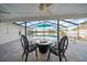 View of the patio with a pool overlooking the lake at 3925 Dunaire Dr, Valrico, FL 33596