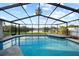 Screen enclosed pool overlooking the lake with brick coping and patio and beautiful view at 3925 Dunaire Dr, Valrico, FL 33596