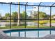 View of the lake from the pool inside the screened-in patio at 3925 Dunaire Dr, Valrico, FL 33596
