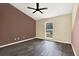 Bedroom featuring a ceiling fan and wood-look floors at 4307 Shadberry Dr, Tampa, FL 33624