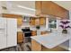 A bright kitchen featuring stainless steel appliances, wood cabinetry, and ample counter space at 4307 Shadberry Dr, Tampa, FL 33624