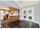 Well-lit kitchen features stainless steel appliances, pendant lights, and hardwood floors at 4307 Shadberry Dr, Tampa, FL 33624