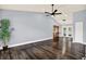 A spacious, empty living room featuring hardwood floors, high ceilings, and an abundance of natural light at 4307 Shadberry Dr, Tampa, FL 33624