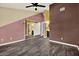 Main bedroom with wood-look flooring leading to the ensuite bathroom at 4307 Shadberry Dr, Tampa, FL 33624