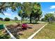 Community playground with swings and play equipment with shade trees and safety ground cover at 4307 Shadberry Dr, Tampa, FL 33624