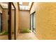 Outdoor courtyard with brick floors, sliding glass doors, and natural light at 4419 Longshore Dr, Land O Lakes, FL 34639