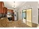 A kitchen featuring granite countertops, stainless steel appliances and ample cabinet space in a well-lit area at 4419 Longshore Dr, Land O Lakes, FL 34639