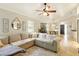 Cozy living room with an overhead fan and tile floors throughout the house at 4419 Longshore Dr, Land O Lakes, FL 34639