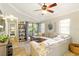 Comfortable living room with ample light, neutral tones, and access to a patio and the bedroom hallway at 4419 Longshore Dr, Land O Lakes, FL 34639