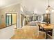 Open-concept living space flows from kitchen to dining, into the living room with natural light and tile floors at 4419 Longshore Dr, Land O Lakes, FL 34639