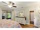 Main bedroom featuring light hardwood floors and a view of the outside patio at 4419 Longshore Dr, Land O Lakes, FL 34639