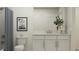 Bright bathroom with a modern vanity, sleek hardware, a marble countertop and decorative art at 4511 S Manhattan Ave # 3, Tampa, FL 33611