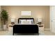 This bedroom features a cozy bed with decorative pillows, elegant lamps, and stylish nightstands at 4511 S Manhattan Ave # 3, Tampa, FL 33611