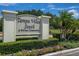 Community sign for Tampa Villas South with manicured landscaping and a private entrance at 4517 La Capri Ct, Tampa, FL 33611