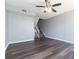 A spacious living room featuring dark wood floors and a staircase to the second level at 4517 La Capri Ct, Tampa, FL 33611