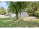 View of the house from backyard featuring a tree at 4804 N 18Th St, Tampa, FL 33610