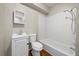 Functional bathroom with white vanity, toilet, and a tiled shower-tub combination at 4804 N 18Th St, Tampa, FL 33610