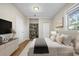 Stylishly arranged bedroom with decorative shelves and neutral color scheme at 4804 N 18Th St, Tampa, FL 33610