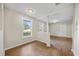 Bright dining area with hardwood floors and views into the living room at 4804 N 18Th St, Tampa, FL 33610