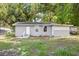 Charming single-story home with a well-maintained lawn and cozy front porch at 4804 N 18Th St, Tampa, FL 33610