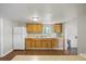 Functional kitchen featuring wooden cabinets and a white refrigerator at 4804 N 18Th St, Tampa, FL 33610