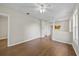 Spacious living room features wood-look floors, neutral walls, and a ceiling fan at 4804 N 18Th St, Tampa, FL 33610