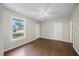 Open living room with hardwood floors, a ceiling fan, and natural light at 4804 N 18Th St, Tampa, FL 33610