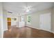 Spacious living room featuring hardwood floors, a ceiling fan, and an open layout at 4804 N 18Th St, Tampa, FL 33610