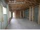 Unfinished basement with concrete floors, exposed ductwork, and a blank canvas for a new homeowner at 503 W Warren Ave # 1, Tampa, FL 33624