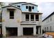 Exterior view of a new construction home showing the frame of the facade and two-car garage at 503 W Warren Ave # 1, Tampa, FL 33624