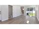 Open living room with sliding glass doors leading to the backyard and featuring tile flooring at 503 W Warren Ave # 1, Tampa, FL 33624