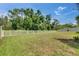 Spacious, well-maintained backyard with a white picket fence, perfect for outdoor activities and privacy at 5057 Ivory Stone Dr, Wimauma, FL 33598
