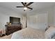 Cozy bedroom with large closet and television on top of a chest of drawers at 5057 Ivory Stone Dr, Wimauma, FL 33598