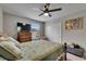 Bedroom with a ceiling fan, carpet and a large window at 5057 Ivory Stone Dr, Wimauma, FL 33598
