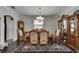 Formal dining room with chandelier and hardwood flooring, perfect for entertaining at 5057 Ivory Stone Dr, Wimauma, FL 33598