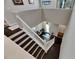Grand entryway foyer featuring a dark wood staircase and ample natural light at 5057 Ivory Stone Dr, Wimauma, FL 33598