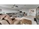 Relaxing living room featuring a large sectional couch and neutral color palette at 5057 Ivory Stone Dr, Wimauma, FL 33598